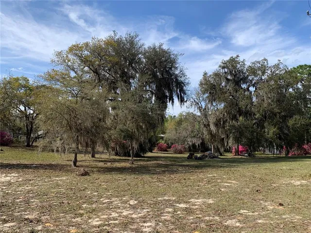 a kitchen with a sink stove and microwave