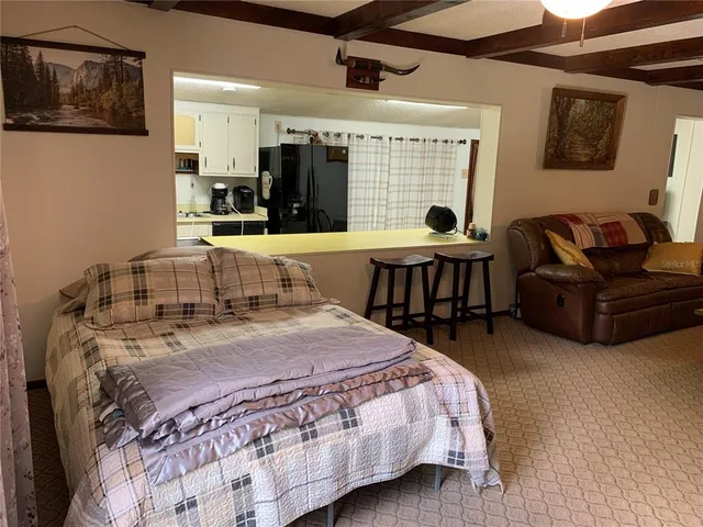 a view of a house that has a backyard