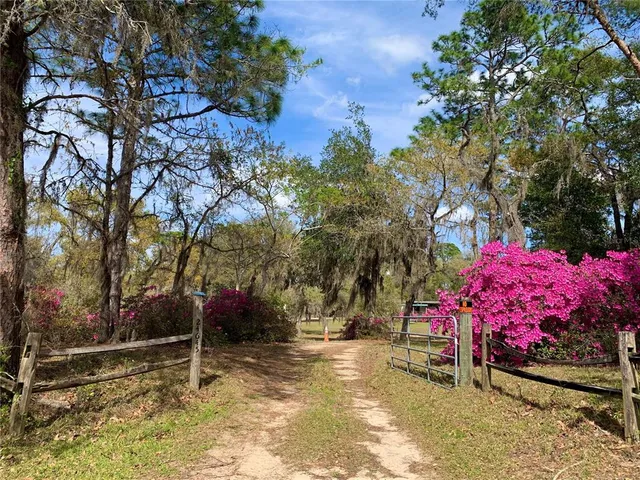 a small hurt is sitting in the middle of a yard