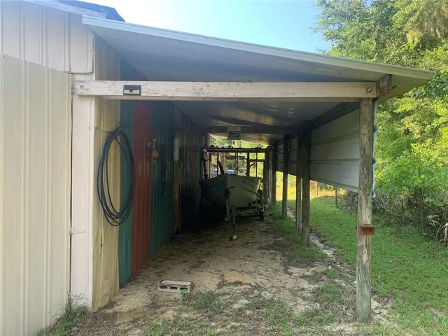 a view of swimming pool with outdoor seating and plants
