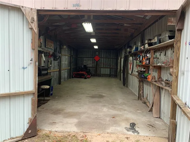a view of a house with backyard and garden