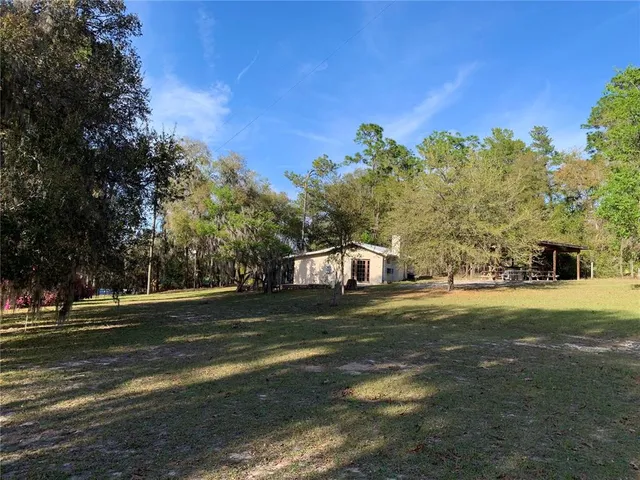 a sitting area with furniture on wooden floor
