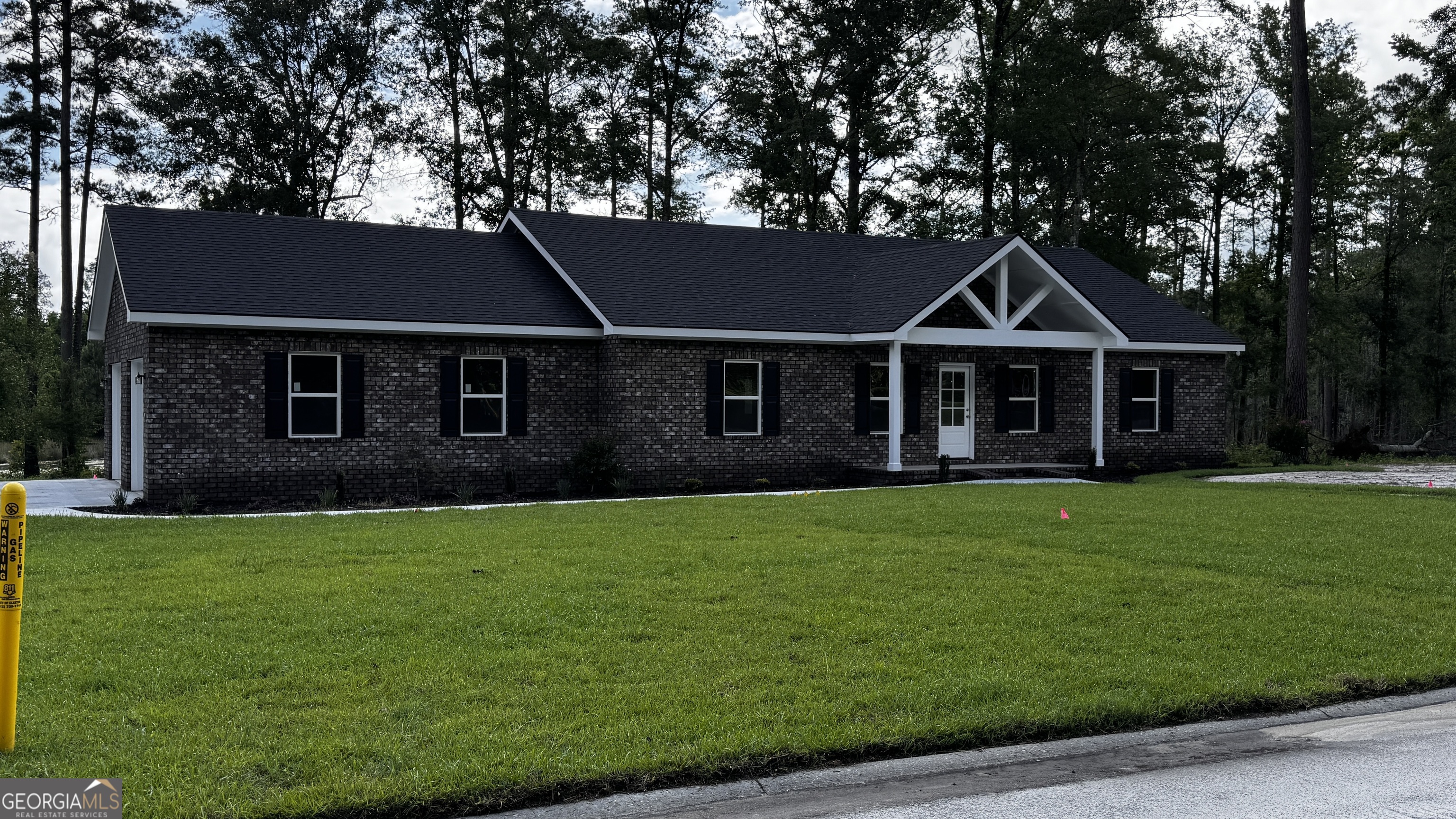 3 Willow Pointe Claxton, GA 30417 - Photo 1 of 31 a front view of a house with a garden