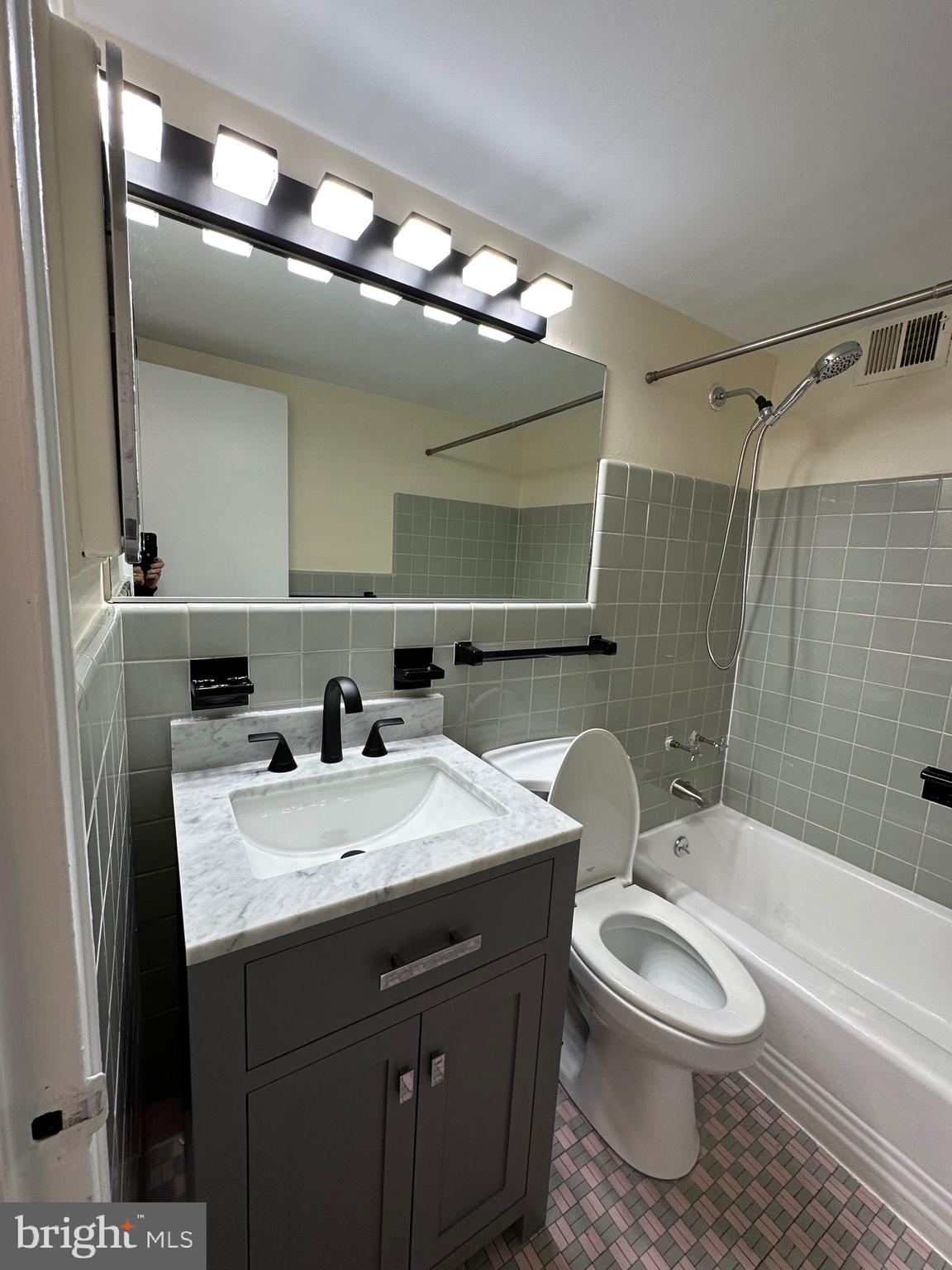 2101 Chestnut Street, Unit 811 Philadelphia, PA 19103 - Photo 13 of 17 a bathroom with a sink toilet and shower