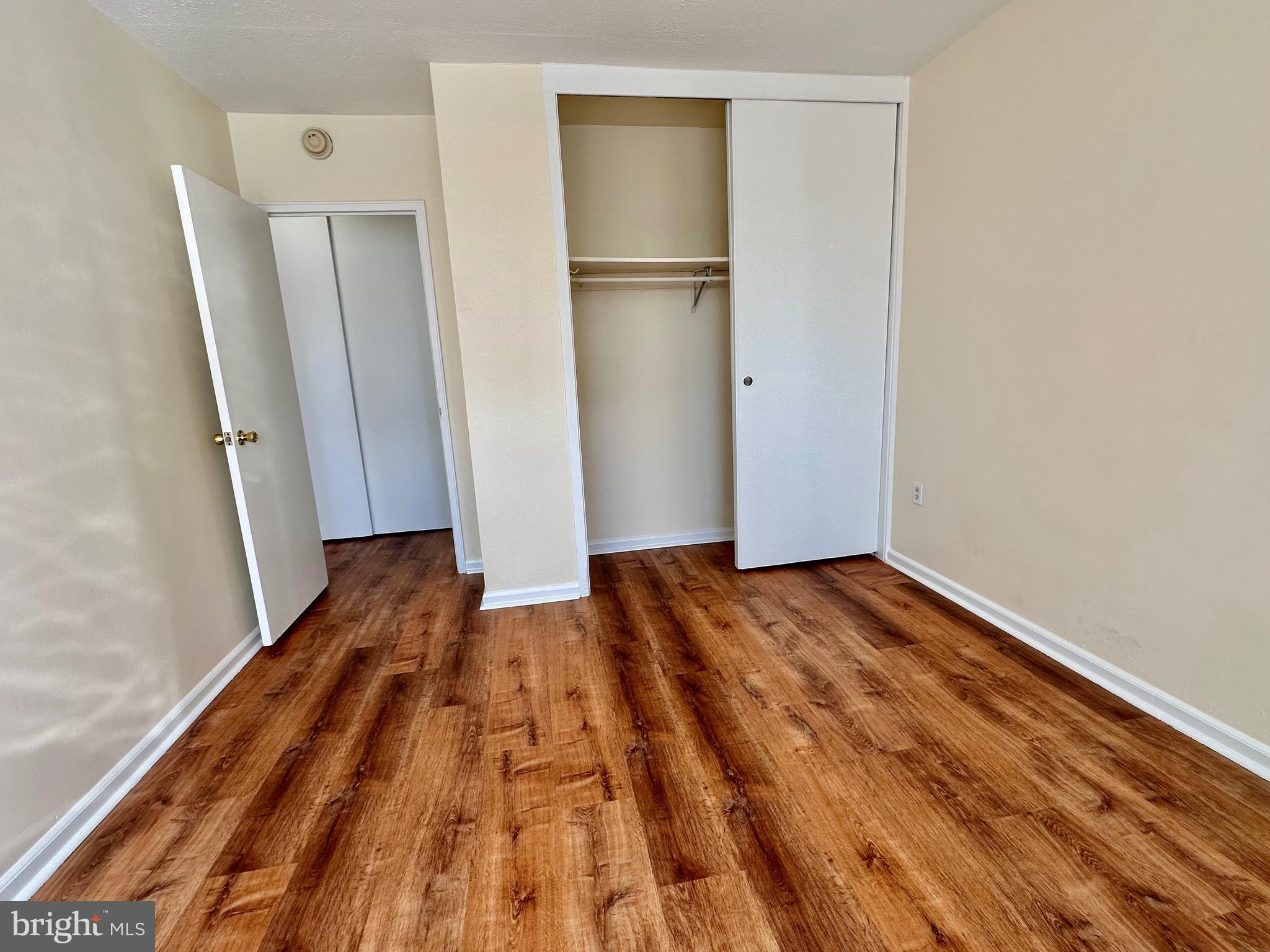 2101 Chestnut Street, Unit 811 Philadelphia, PA 19103 - Photo 15 of 17 a view of a room with wooden floor and a hallway