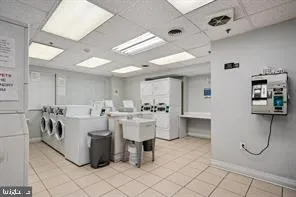 a large white building with a sink and mirror