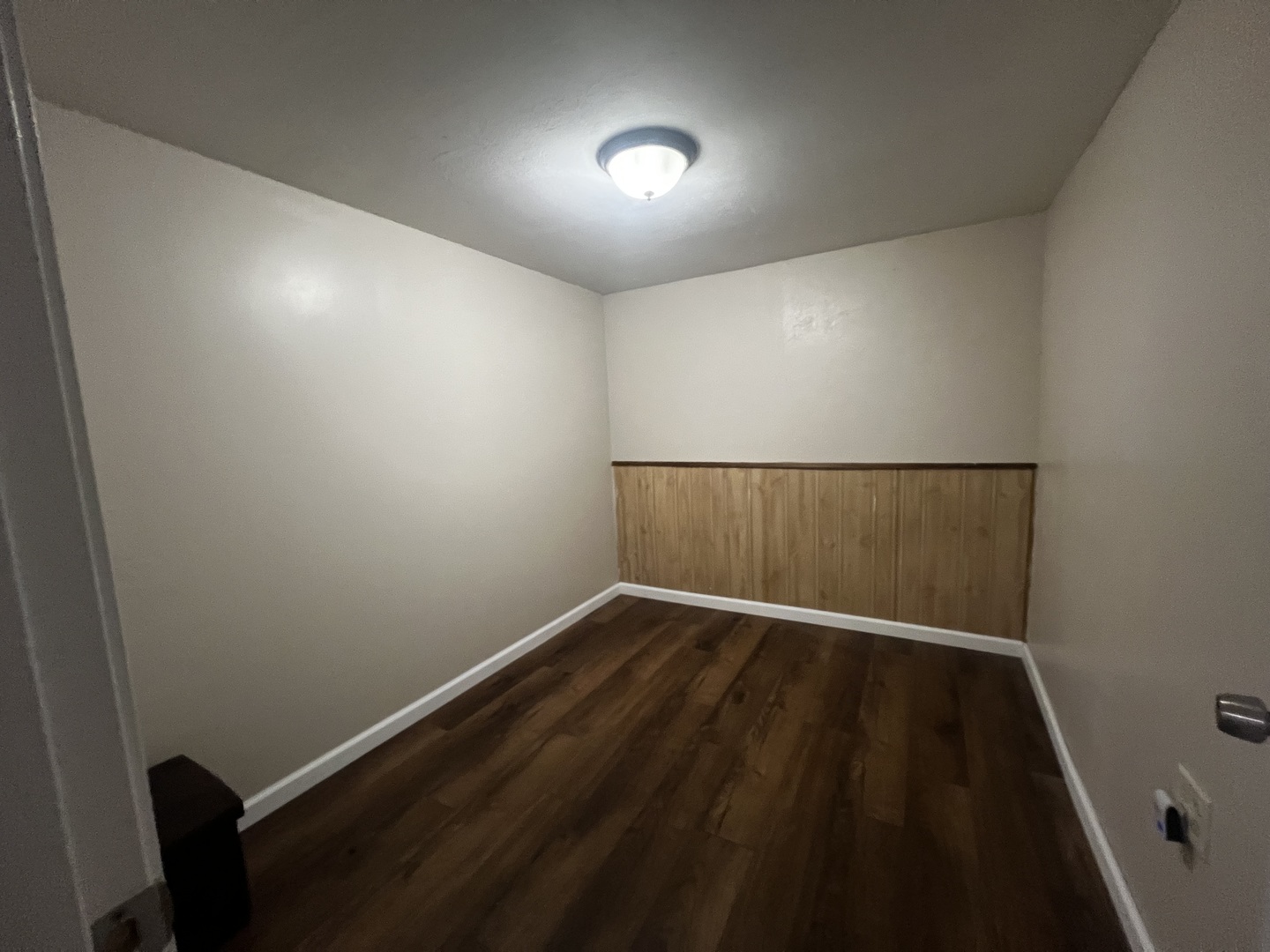 1930 23rd Street Zion, IL 60099 - Photo 14 of 20 an empty room with wooden floor and windows