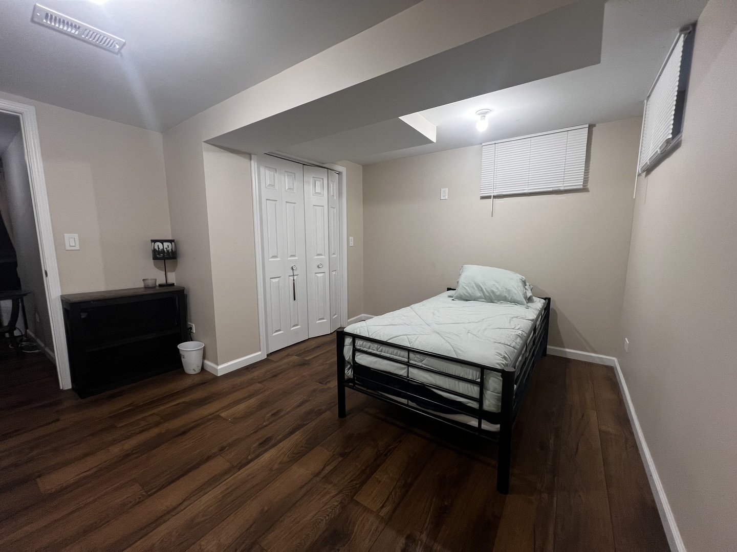 1930 23rd Street Zion, IL 60099 - Photo 17 of 20 a spacious bedroom with a bed and wooden floor