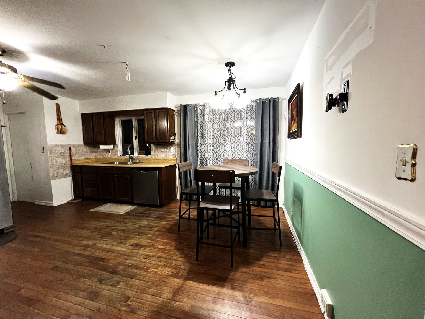 1930 23rd Street Zion, IL 60099 - Photo 5 of 20 a view of a dining room with furniture and wooden floor
