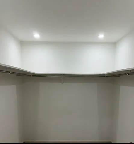 an empty room with a wooden floor