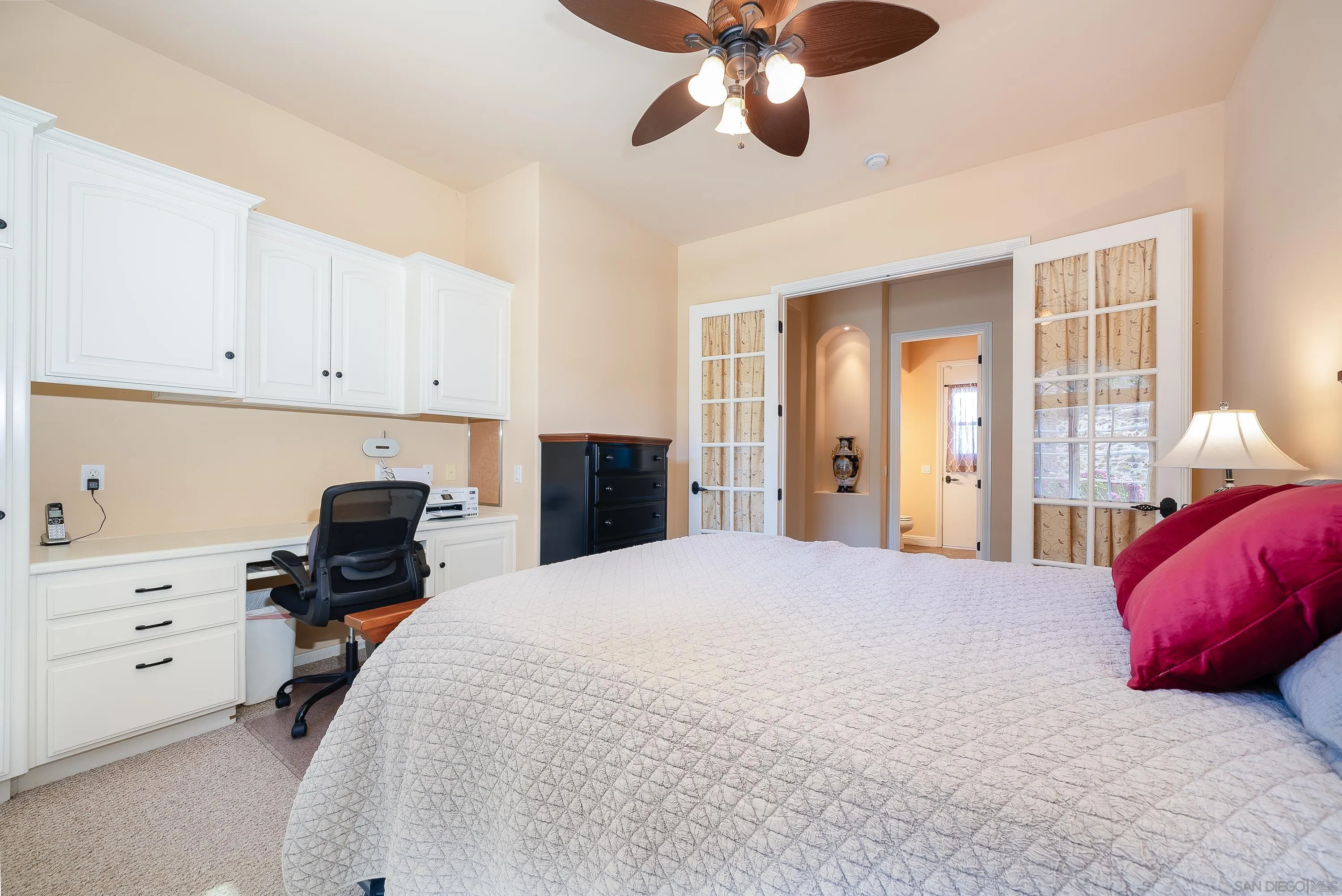3330 Brooke Hollow Road Fallbrook, CA 92028 - Photo 27 of 67 a bedroom with a bed and cabinets