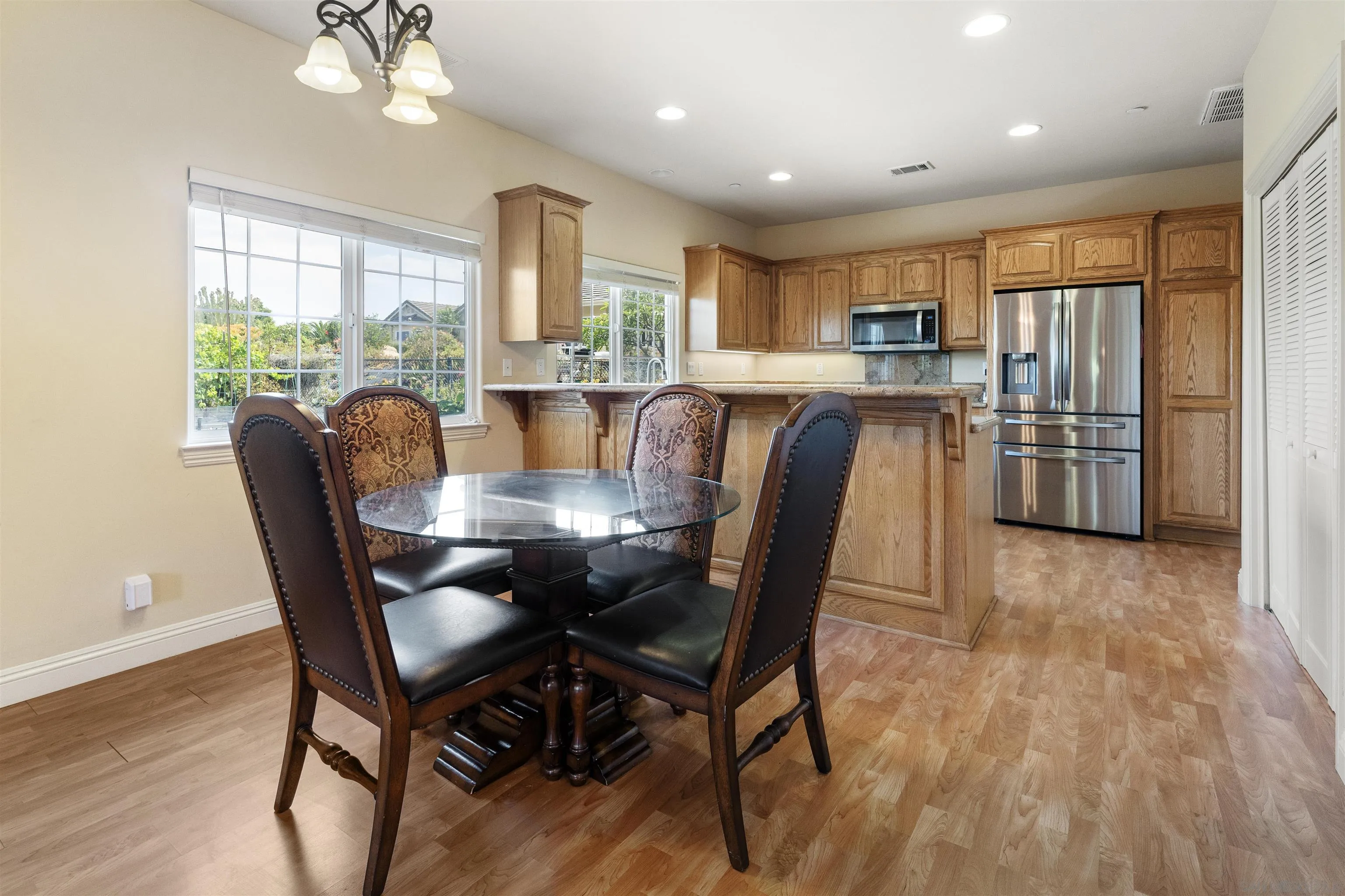 3330 Brooke Hollow Road Fallbrook, CA 92028 - Photo 44 of 67 a view of a dining room with furniture window and wooden floor