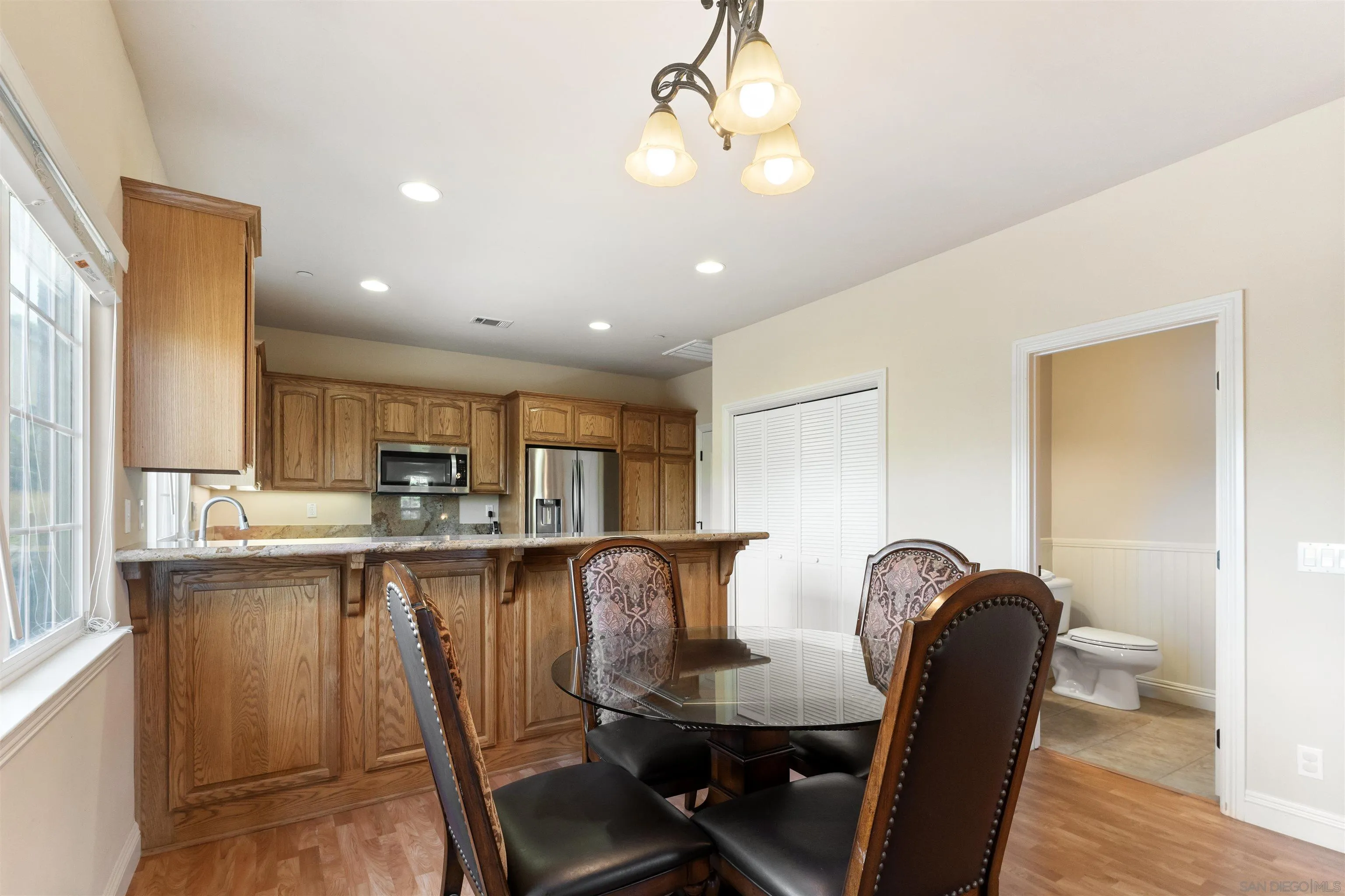 3330 Brooke Hollow Road Fallbrook, CA 92028 - Photo 45 of 67 a dining table with chairs and wooden floor