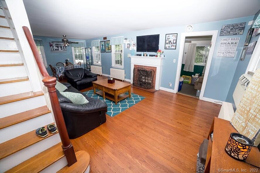 ~Charming Space~This Darling 3 Bedroom, 1 and a Half Bath New England Cape Cod Style home offers a Unique, Versatile, Flexible (Open) Floor Plan~ Lovely Spacious, Living area~Cozy wood-burning Fireplace for cool winter evenings~Gleaming Hardwoods~Adorable Playroom off Living Room(could serve as Office space as well)~Main Level Bedroom En Suite w/its' own Half Bath)~Lots of Windows allowing Abundant Natural Light~Ceiling Fans~Large Full Basement w/Back yard access~Ample closet space throughout~Welcome Home~