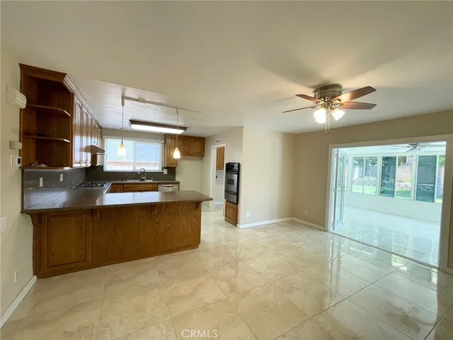 a kitchen with stainless steel appliances granite countertop a sink and cabinets