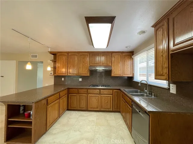 a kitchen with lots of counter space and a sink