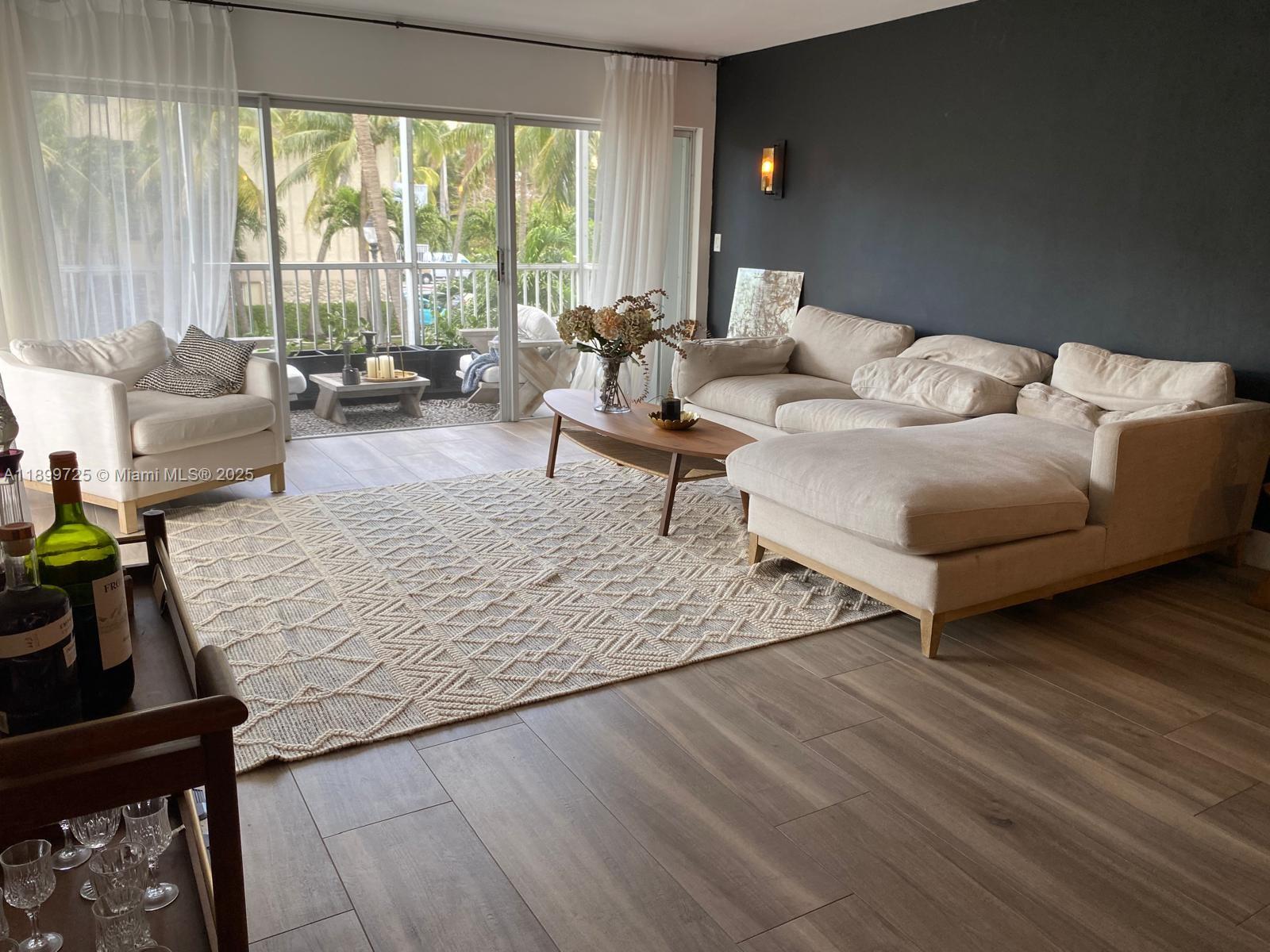 550 Ocean Drive, Unit 2D Key Biscayne, FL 33149 - Photo 11 of 35 a living room with furniture and a large window