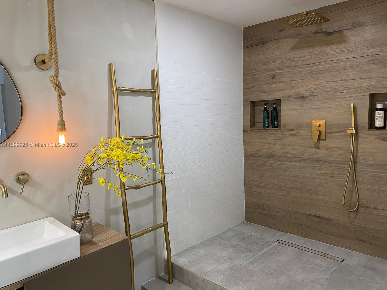 550 Ocean Drive, Unit 2D Key Biscayne, FL 33149 - Photo 25 of 35 a bathroom with a sink and mirror