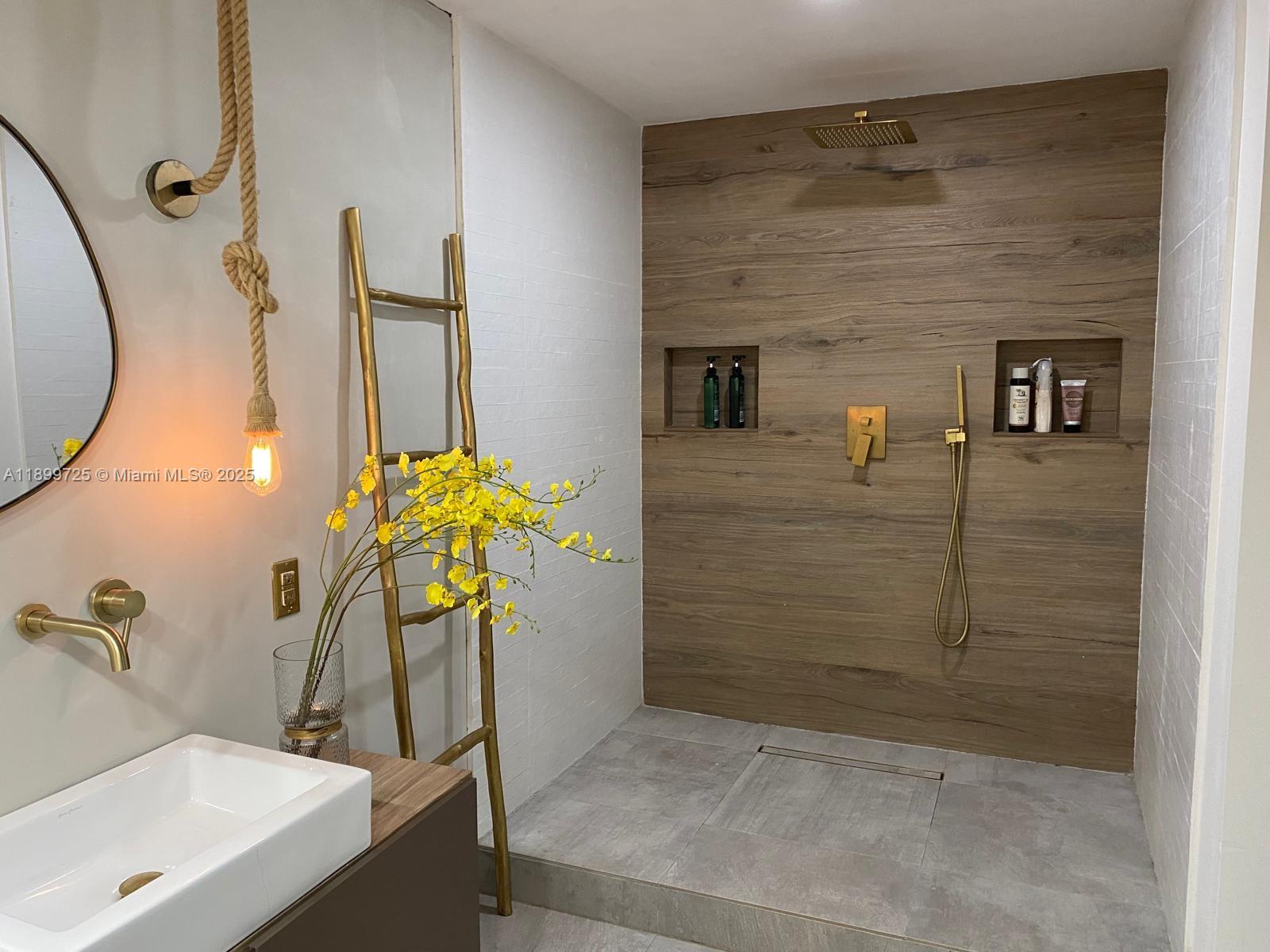 550 Ocean Drive, Unit 2D Key Biscayne, FL 33149 - Photo 27 of 35 a bathroom with a sink a potted plant and a shower