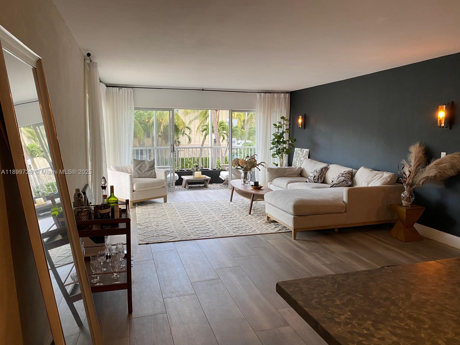 550 Ocean Drive, Unit 2D Key Biscayne, FL 33149 - Photo 3 of 35 a living room with furniture and a large window