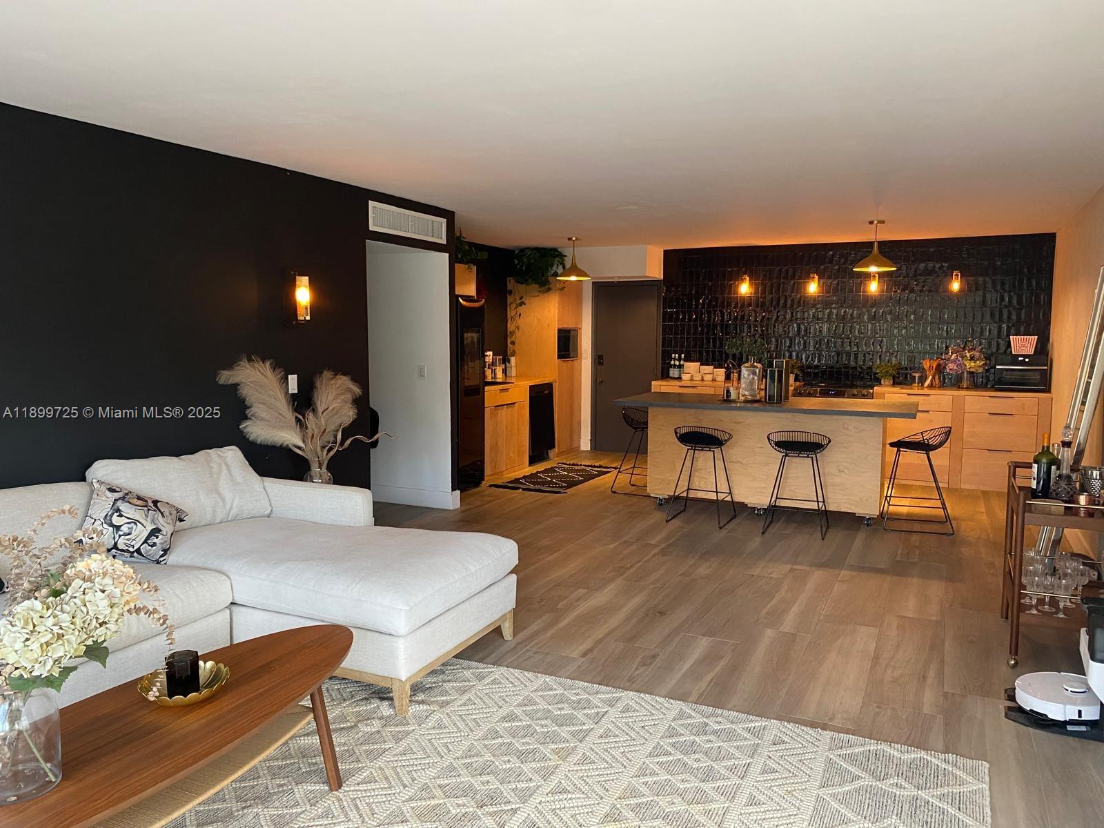 550 Ocean Drive, Unit 2D Key Biscayne, FL 33149 - Photo 9 of 35 a living room with furniture and a wooden floor