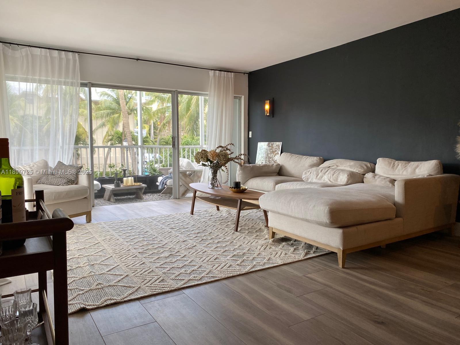 550 Ocean Drive, Unit 2D Key Biscayne, FL 33149 - Photo 10 of 35 a living room with furniture and a large window