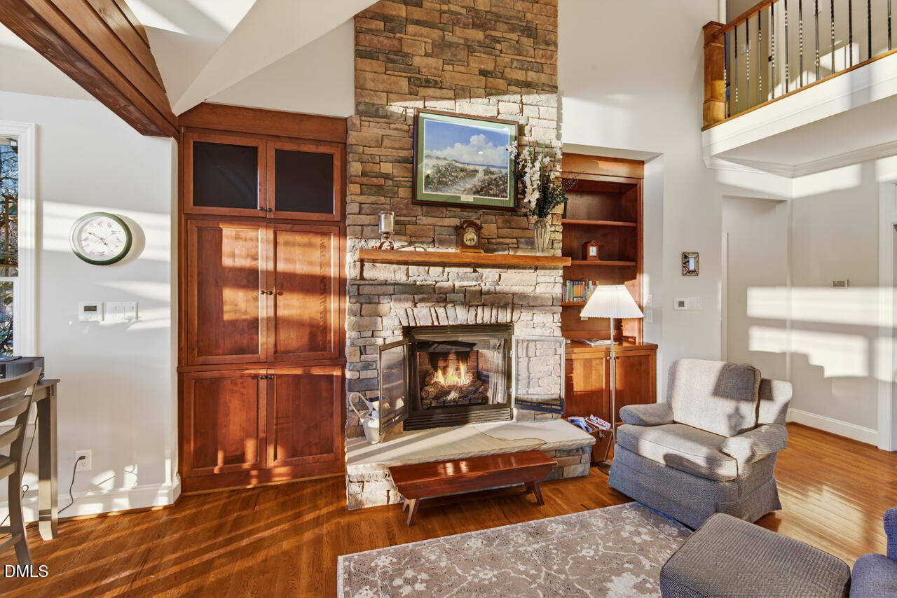 10775 Buffalo Creek Road Rougemont, NC 27572 - Photo 17 of 65 a living room with furniture a fireplace and a flat screen tv