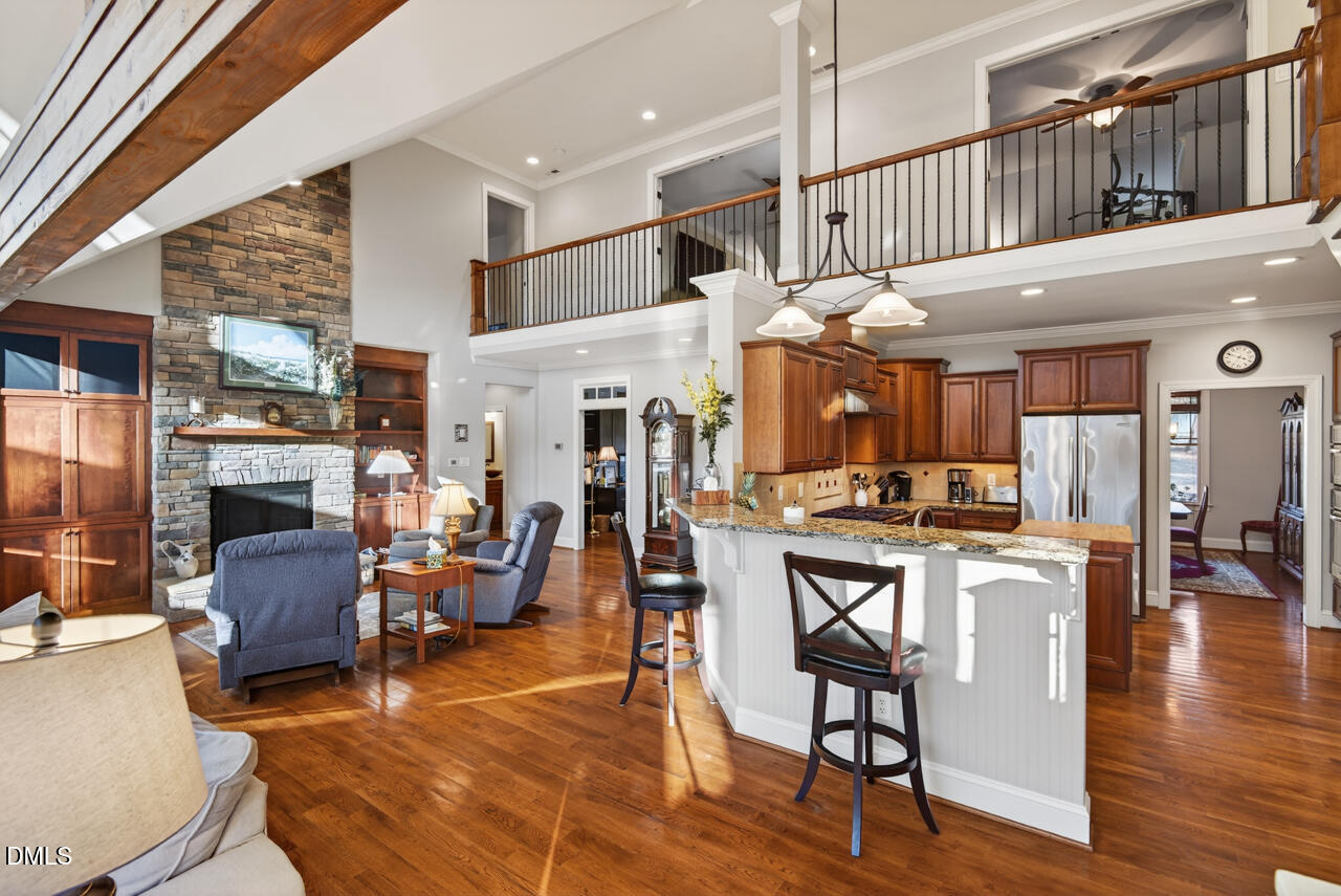 10775 Buffalo Creek Road Rougemont, NC 27572 - Photo 23 of 65 a living room with fireplace furniture and a wooden floor
