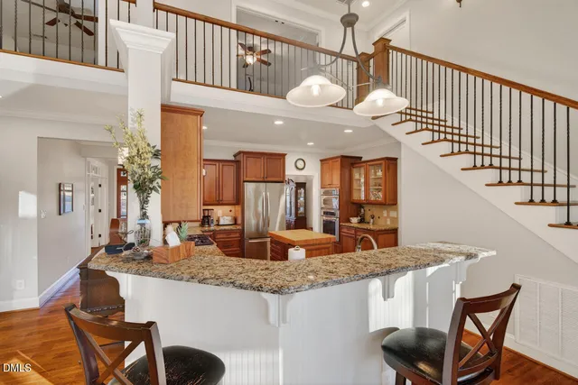a view of living room and furniture with wooden floor