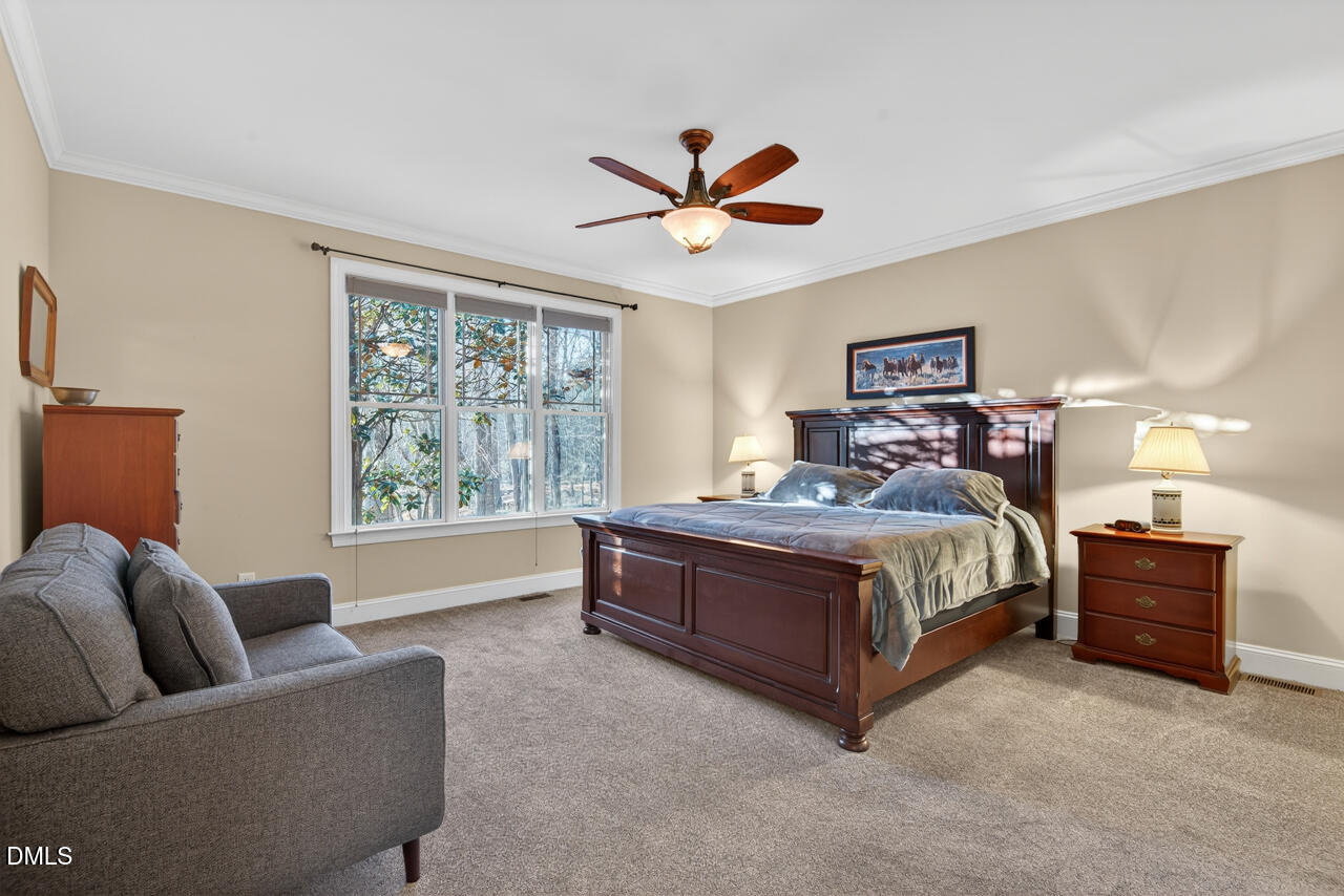 10775 Buffalo Creek Road Rougemont, NC 27572 - Photo 30 of 65 a bedroom with a bed couches and window