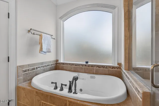 a bathroom with a sink double vanity and mirror