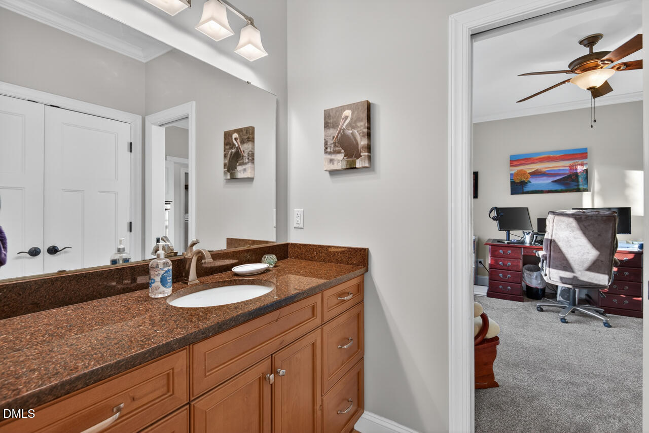 10775 Buffalo Creek Road Rougemont, NC 27572 - Photo 38 of 65 a bathroom with a sink double vanity and mirror