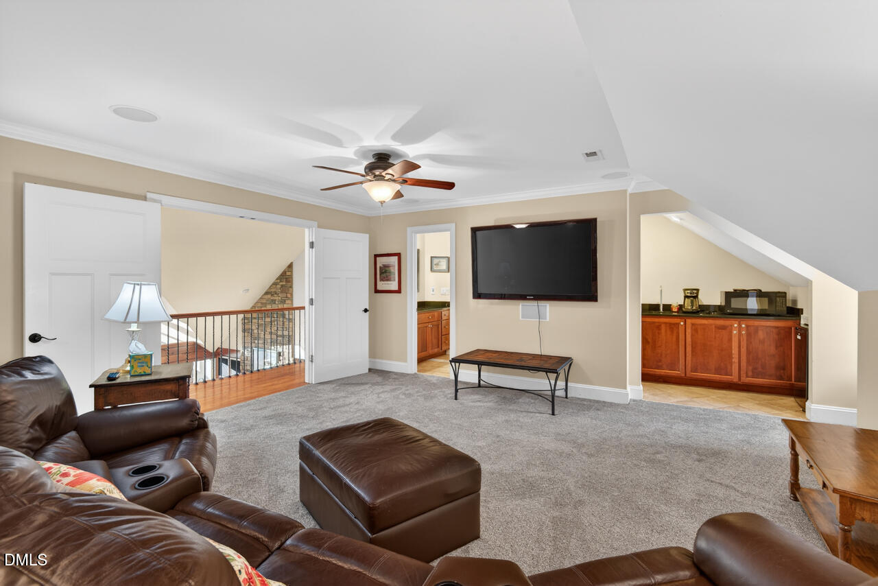 10775 Buffalo Creek Road Rougemont, NC 27572 - Photo 43 of 65 a living room with furniture and a flat screen tv