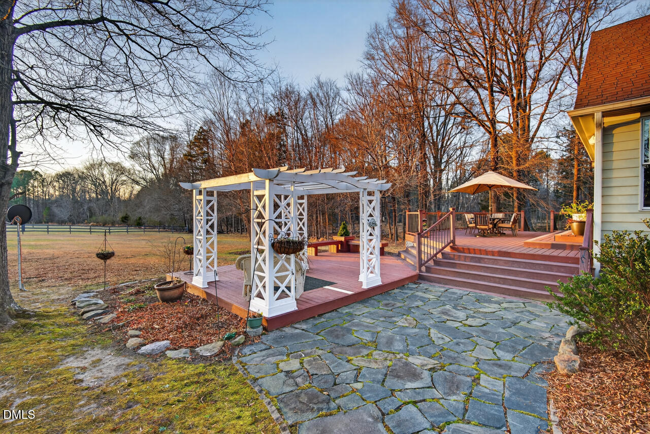 10775 Buffalo Creek Road Rougemont, NC 27572 - Photo 51 of 65 a view of a house with backyard porch and sitting area