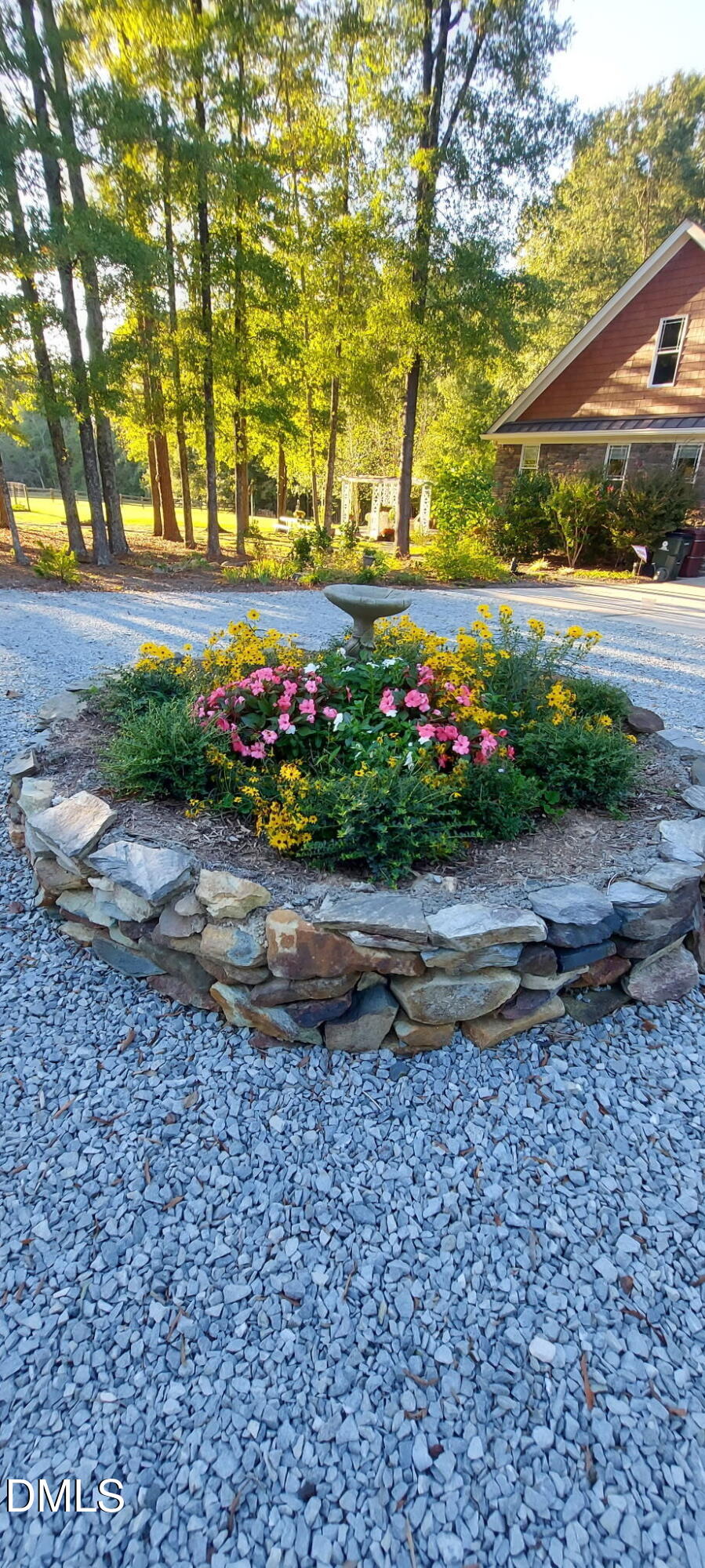 10775 Buffalo Creek Road Rougemont, NC 27572 - Photo 64 of 65 a view of a garden with flowers and trees