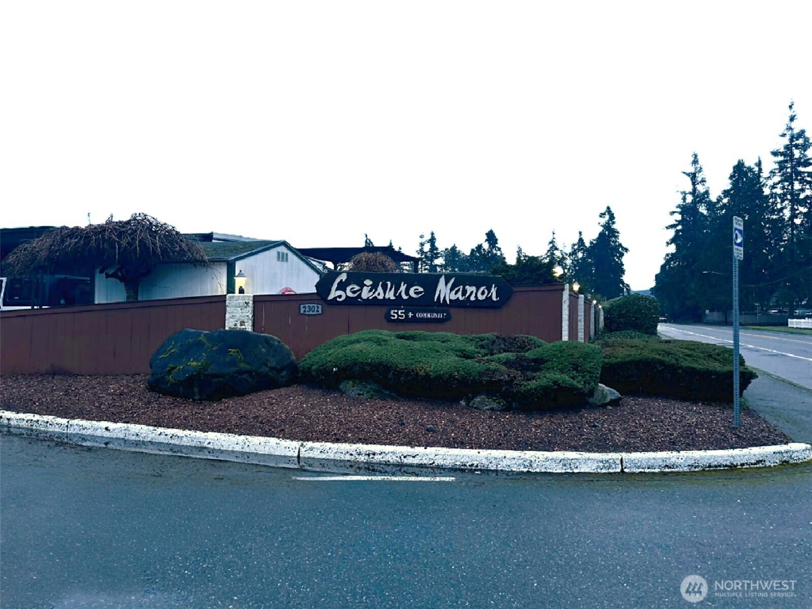 2302 R Street Southeast, Unit 125 Auburn, WA 98002 - Photo 20 of 20 a view of a house with a swimming pool and a yard