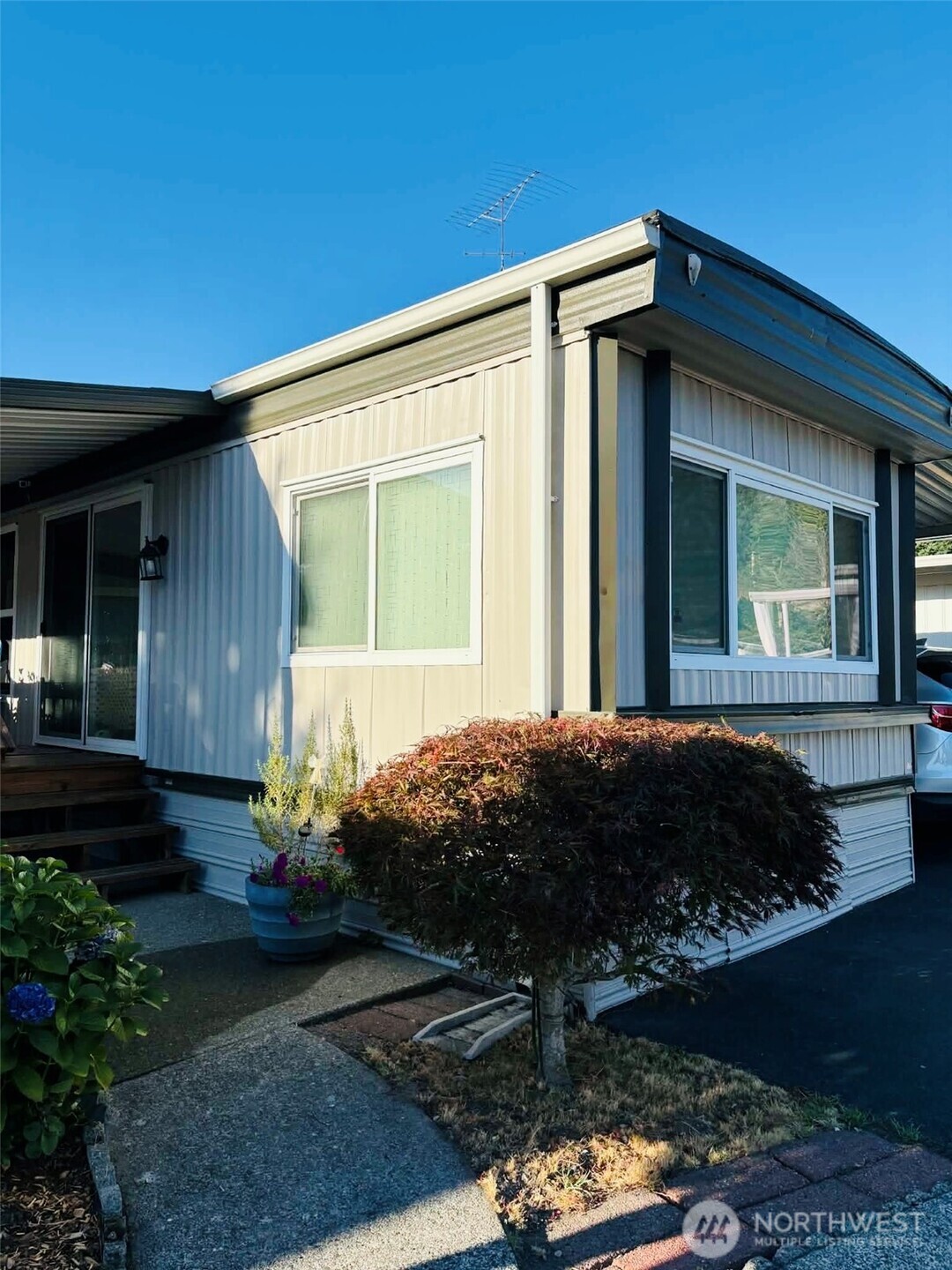 2302 R Street Southeast, Unit 125 Auburn, WA 98002 - Photo 2 of 20 a view of a house with a garden