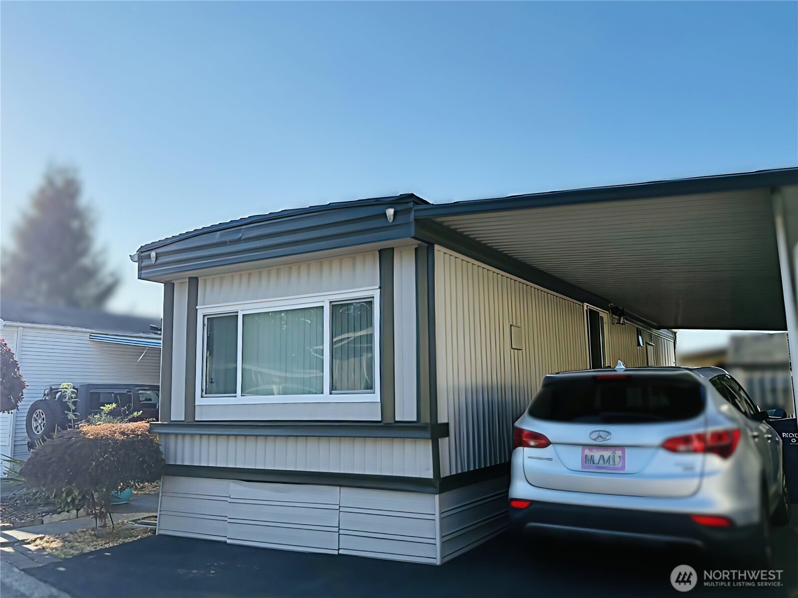 2302 R Street Southeast, Unit 125 Auburn, WA 98002 - Photo 3 of 20 a car parked in front of a house