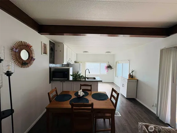 a kitchen with a sink stainless steel appliances and cabinets
