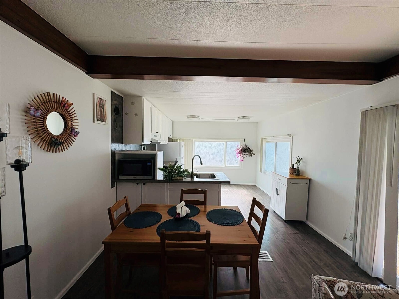 2302 R Street Southeast, Unit 125 Auburn, WA 98002 - Photo 6 of 20 a kitchen with a sink stainless steel appliances and cabinets