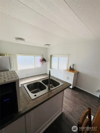 a kitchen that has a sink and a stove