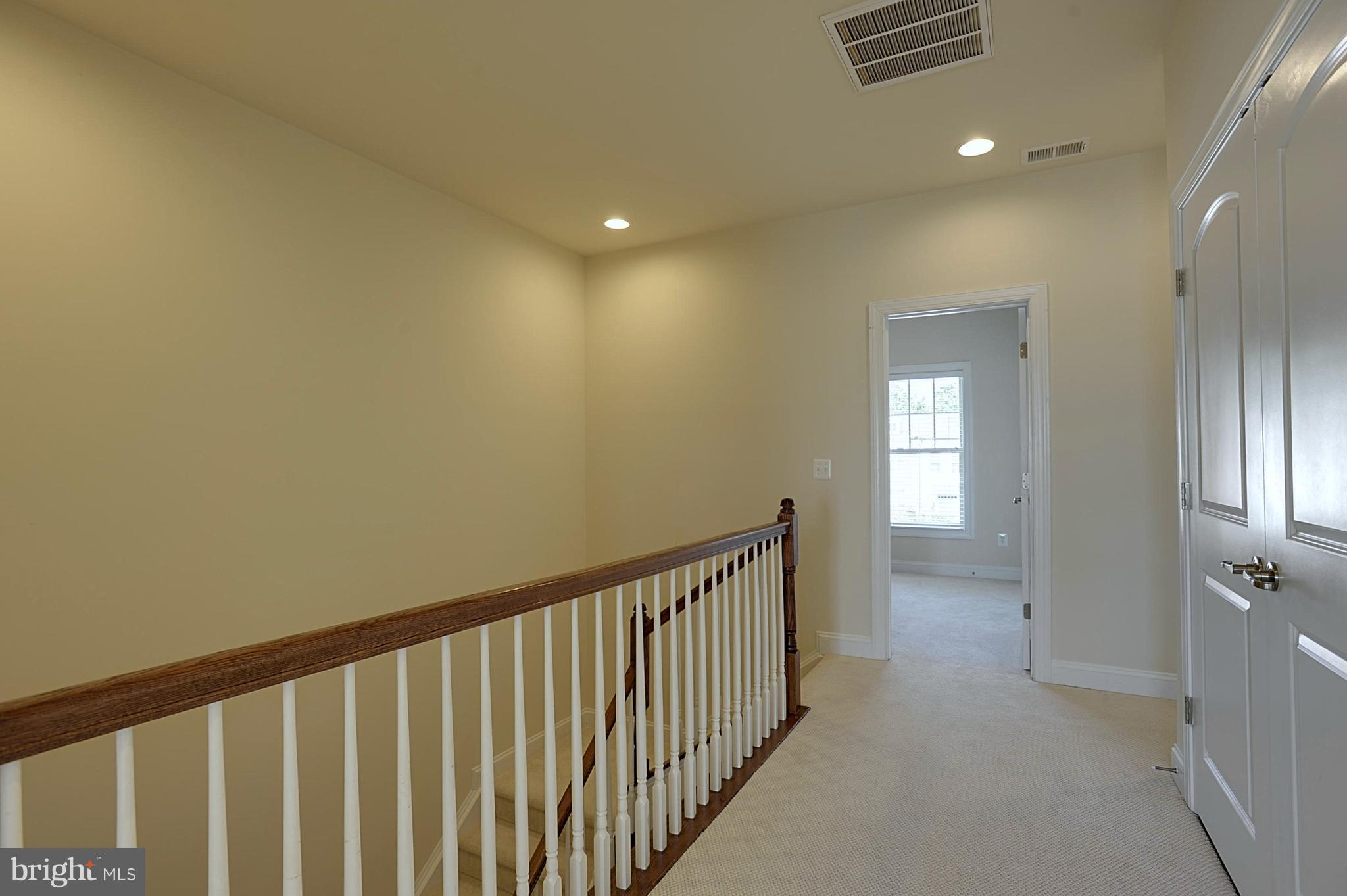 43346 Old Ryan Road Ashburn, VA 20148 - Photo 13 of 25 Upper level hall w/large laundry closet