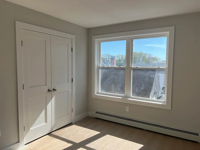 an empty room with large window