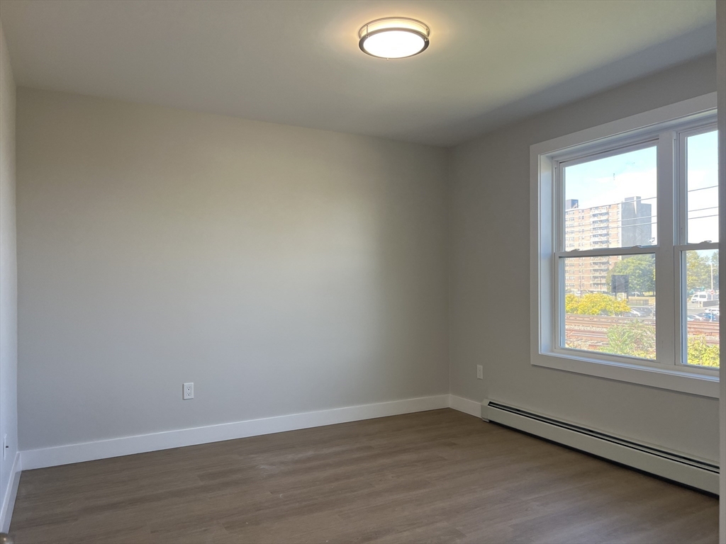 151 Shepard Street, Unit 14 Lynn, MA 01902 - Photo 18 of 22 an empty room with a window