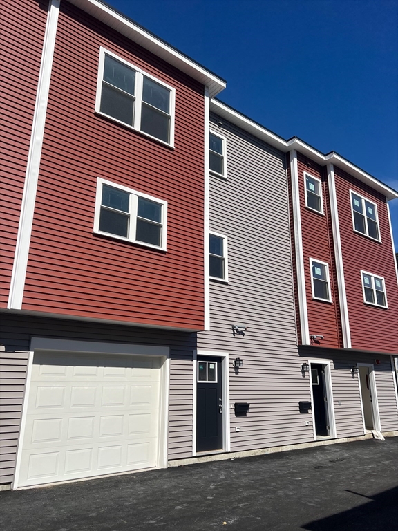 151 Shepard Street, Unit 14 Lynn, MA 01902 - Photo 22 of 22 a front view of a house with windows