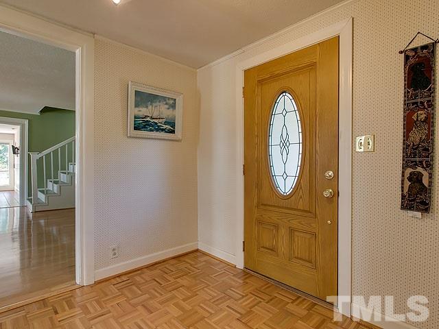 8318 South Lowell Road Bahama, NC 27503 - Photo 22 of 25 a view of front door with wooden floor