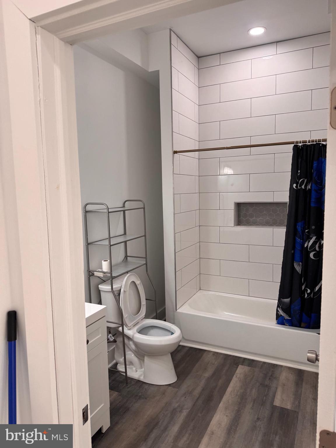 4906 Harford Road Baltimore, MD 21214 - Photo 28 of 31 a bathroom with a toilet and a shower