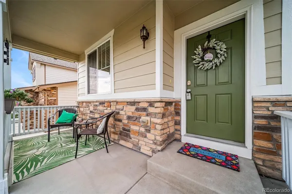 a view of front door with chair and door