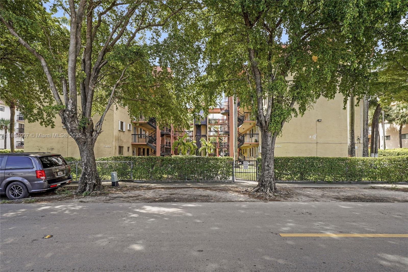 5490 West 21st Court, Unit 112 Hialeah, FL 33016 - Photo 13 of 43 a view of street with parked cars