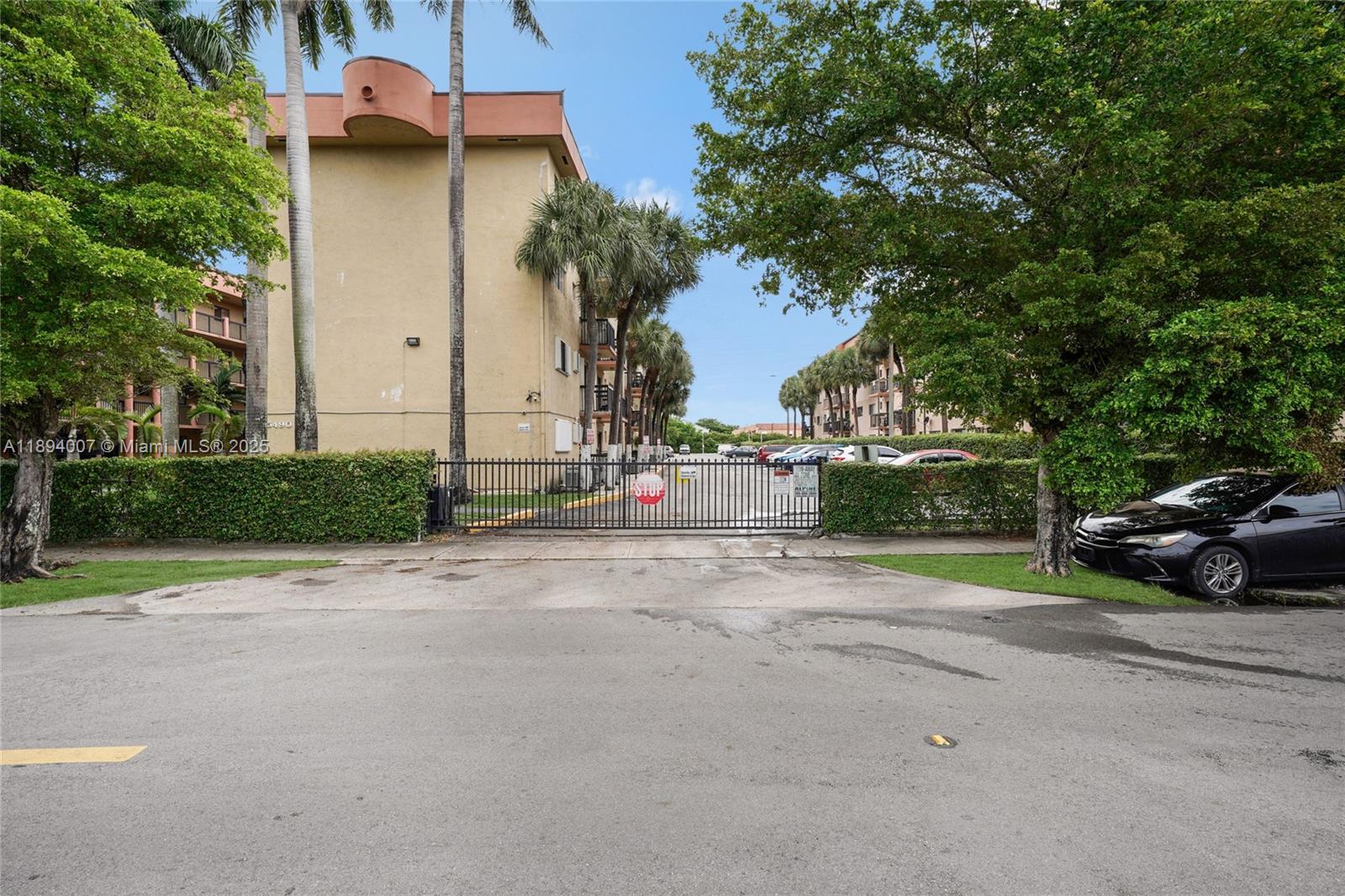 5490 West 21st Court, Unit 112 Hialeah, FL 33016 - Photo 14 of 43 a view of street with parked cars